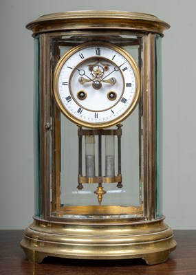 Lot 63 - A French oval brass four-glass mantle clock...