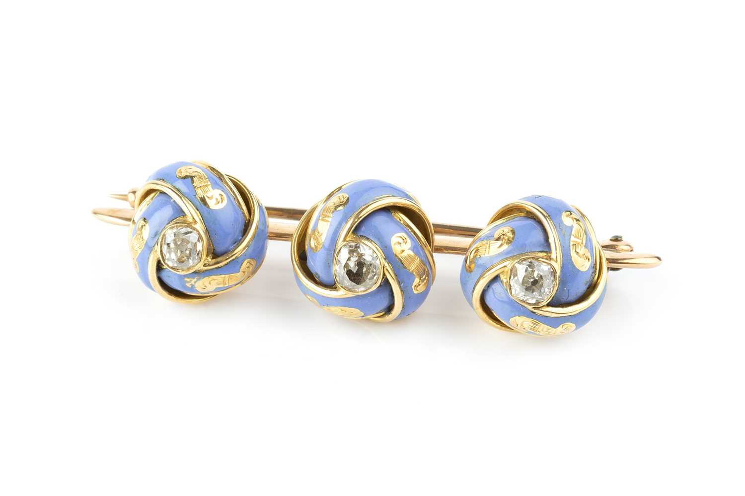 Lot 44 - An enamel and diamond bar brooch, designed as...