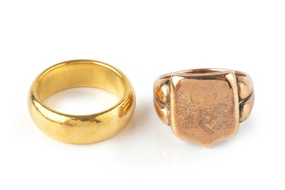 Lot 79 - A 22ct gold wedding band, and a 9ct rose gold...