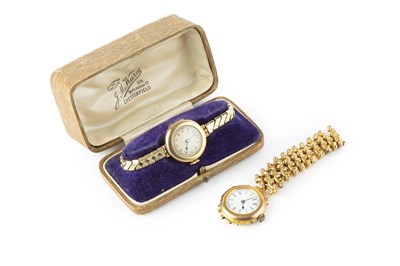 Lot 226 - A lady's bracelet watch, the circular white...