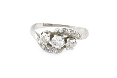 Lot 178 - A diamond three stone crossover ring, the...