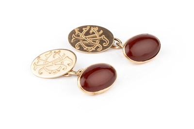 Lot 57 - A pair of carnelian cufflinks, the oval...