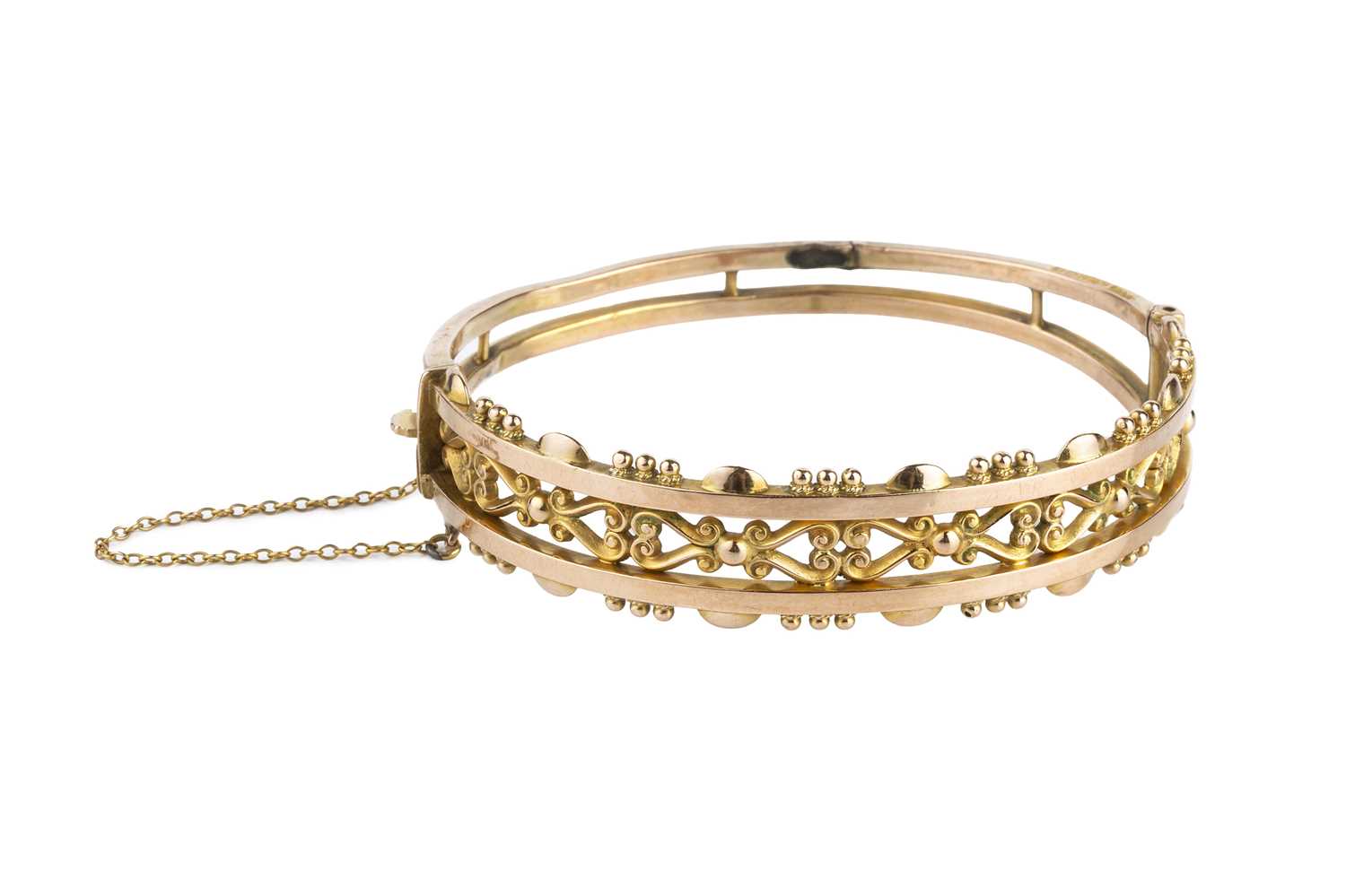 Lot 107 - An Edwardian 9ct gold bangle by Smith & Pepper,...