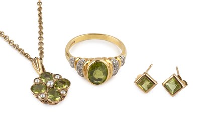 Lot 71 - A peridot and diamond dress ring, the oval...