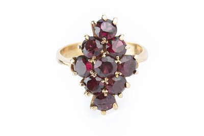 Lot 128 - A garnet cluster ring, the lozenge-shaped...