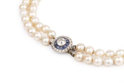 Lot 185 - A cultured pearl collar necklace with sapphire...