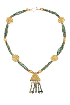 Lot 75 - A faience and coral bead necklace, designed as...