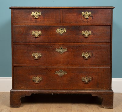 Lot 309 - A George III chest of drawers, darker mahogany,...