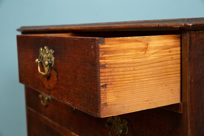 Lot 309 - A George III chest of drawers, darker mahogany,...