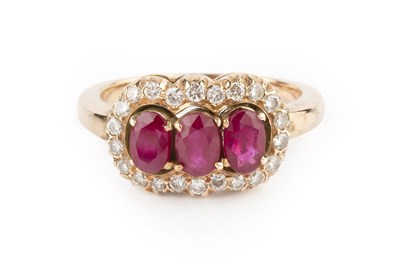 Lot 139 - A ruby and diamond triple cluster ring, the...