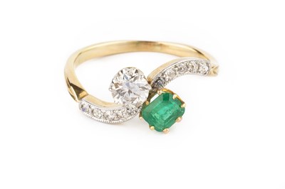 Lot 172 - An emerald and diamond crossover ring,...