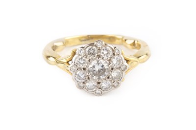 Lot 119 - A diamond cluster ring, the graduated round...