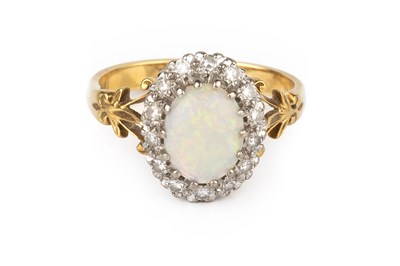 Lot 117 - An opal and diamond cluster ring, the oval...