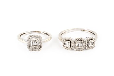 Lot 100 - Two diamond set dress rings, comprising a...