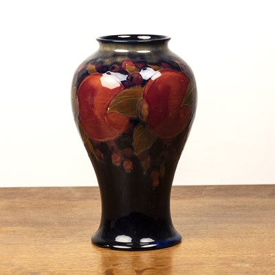 Lot 294 - Moorcroft pottery 'Pomegranate' tall baluster...