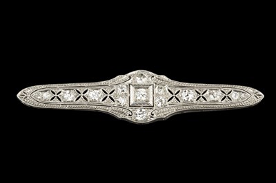 Lot 185 - A diamond panel brooch, the shaped and...