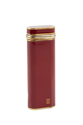 Lot 346 - A gilt metal and burgundy enamel lighter, by...