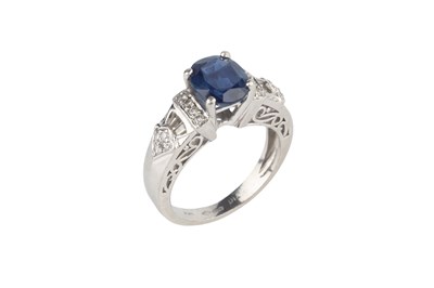Lot 4 - A sapphire and diamond dress ring, the oval...