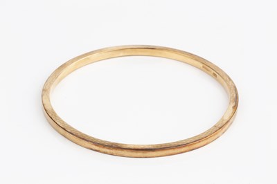 Lot 4 - A 9ct gold slave bangle, of hollow form, with...