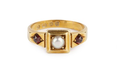 Lot 33 - A garnet and half pearl dress ring, centred...
