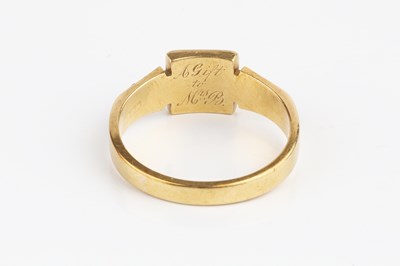 Lot 33 - A garnet and half pearl dress ring, centred...