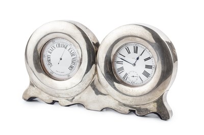 Lot 350 - An Edwardian silver mounted desk timepiece and...