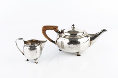 Lot 451 - A George V silver Arts & Crafts style three...