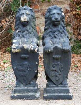 Lot 1211 - Two old cast reconstituted stone black painted...