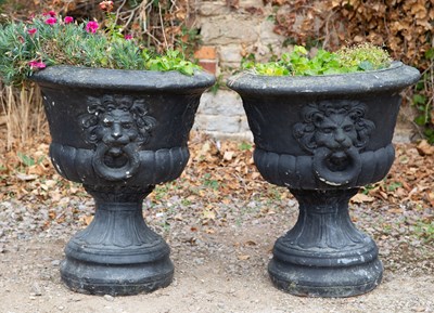 Lot 1152 - A pair of black painted cast reconstituted stone garden urns