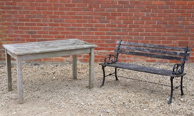 Lot 1139 - A teak garden table and a bench