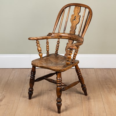 Lot 205 - An antique ash and elm child sized high backed...