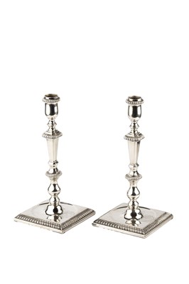 Lot 428 - A pair of George II cast silver candlesticks,...