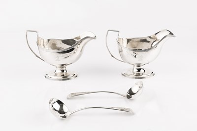 Lot 370 - A pair of George III silver pedestal sauce...