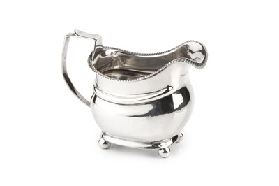 Lot 375 - A George III silver cream jug, with shaped...