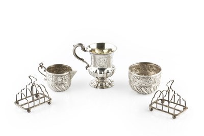 Lot 562 - An Edwardian silver milk jug and matching...