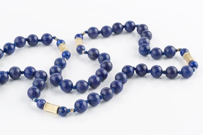 Lot 228 - A lapis lazuli bead necklace, of continuous...