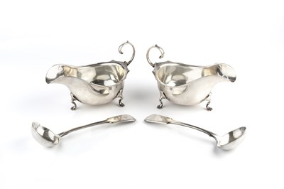 Lot 516 - A pair of George V silver sauce boats, with...