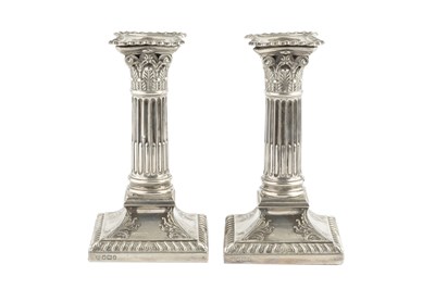 Lot 519 - A pair of late Victorian silver candlesticks,...