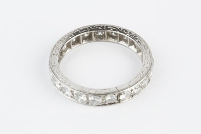 Lot 117 - A diamond full hoop ring, grain set throughout...