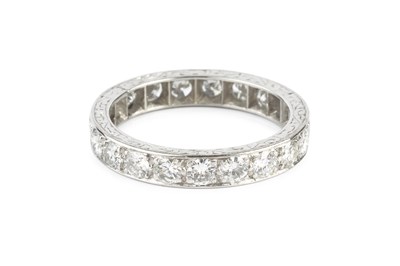 Lot 117 - A diamond full hoop ring, grain set throughout...