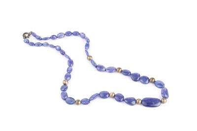 Lot 265 - A tanzanite bead necklace, designed as a...