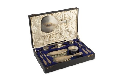 Lot 514 - A George V silver dressing table set, with...