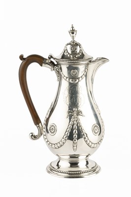 Lot 529 - An early George III silver baluster hot water...