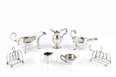 Lot 546 - An Edwardian silver cream jug, with foliate...