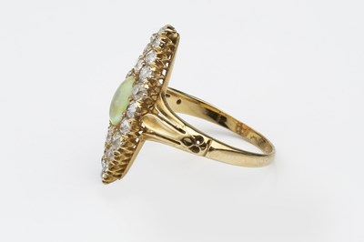 Lot 121 - An opal and diamond panel ring, the...