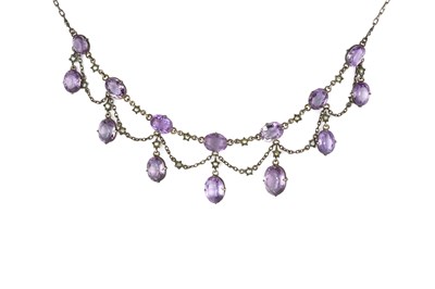 Lot 51 - An amethyst and half pearl fringe necklace,...