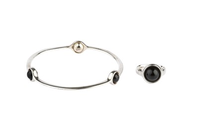 Lot 151 - A silver and onyx 'Sphere' bangle and ring...