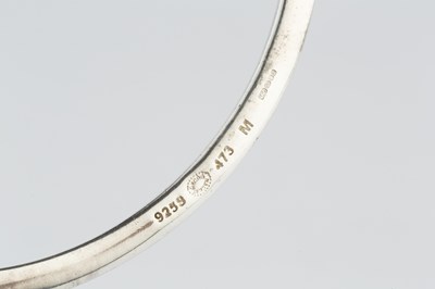 Lot 151 - A silver and onyx 'Sphere' bangle and ring...