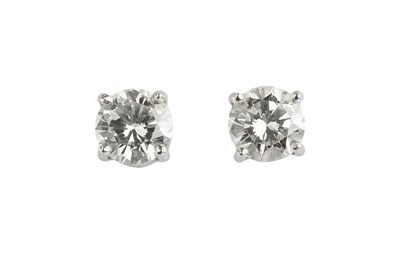 Lot 99 - A pair of diamond single stone ear studs, each...