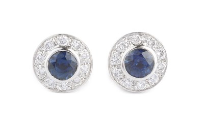 Lot 134 - A pair of sapphire and diamond cluster ear...